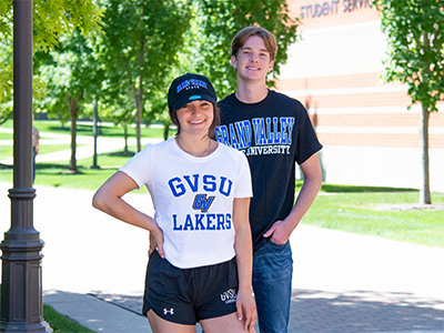 Two students wearing GVSU apparel.